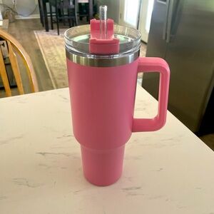 Pink cup with lid and straw